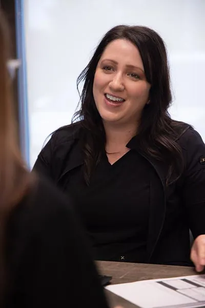 woman smiling during her visit to True Dental Group